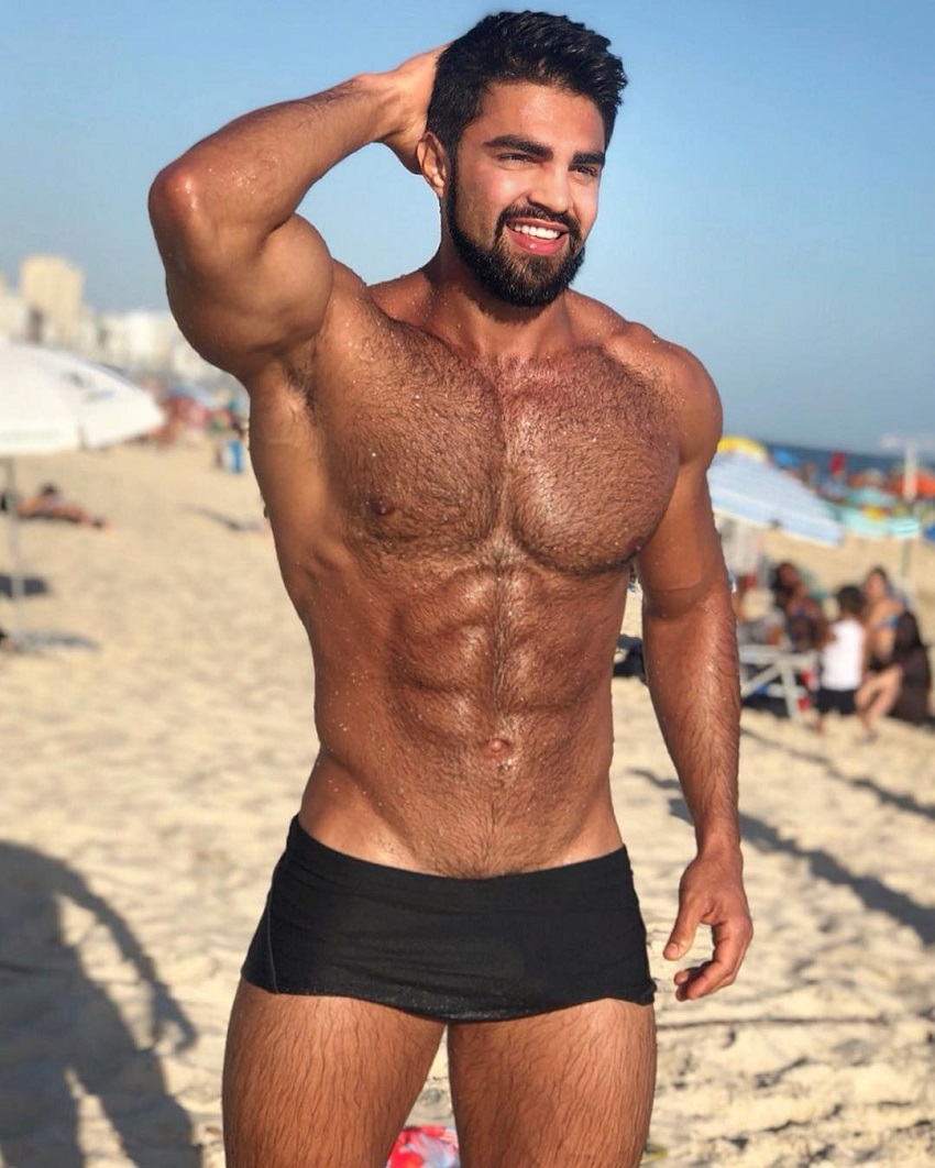 Jefferson Ferreira posing shirtless on the beach looking ripped and lean