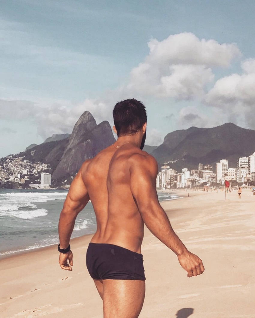 Jefferson Ferreira standing on a beach looking ripped and muscular