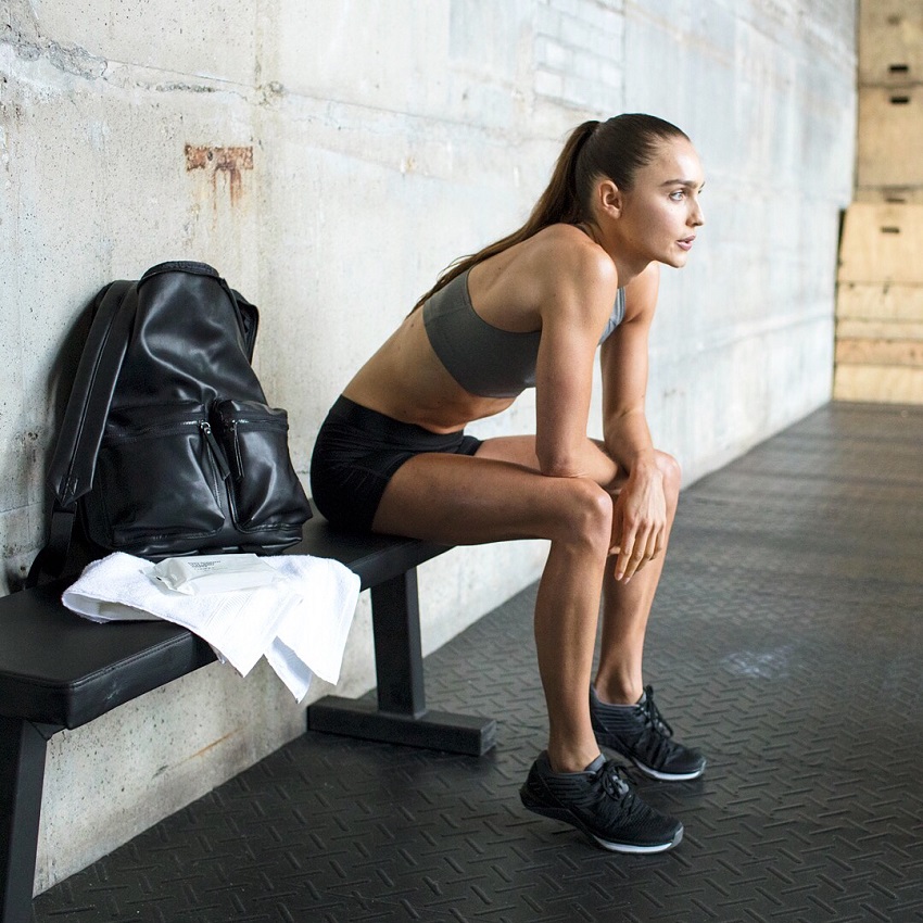 Kirsty Godso sitting on a bench looking fit and lean