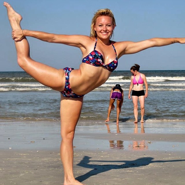 Kylee Nicole posing on a beach in a bikini