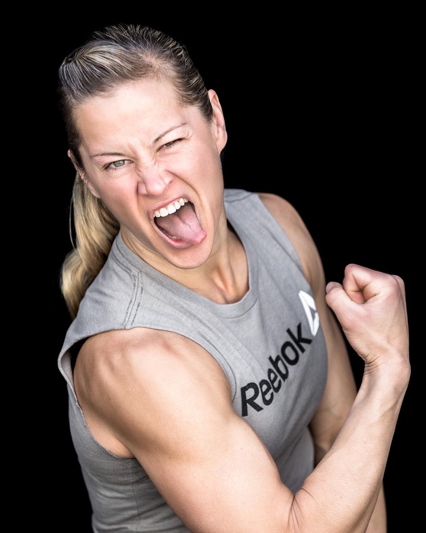 Rebecca Voigt Miller flexing her biceps for the camera looking strong