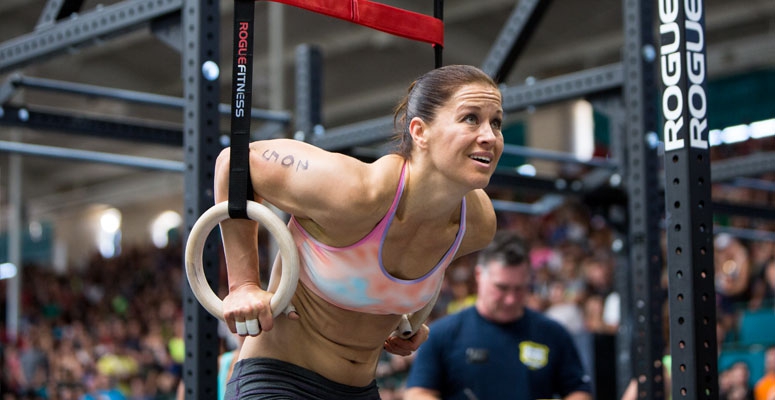 Rebecca Voigt Miller doing ring exercises during a CrossFit event