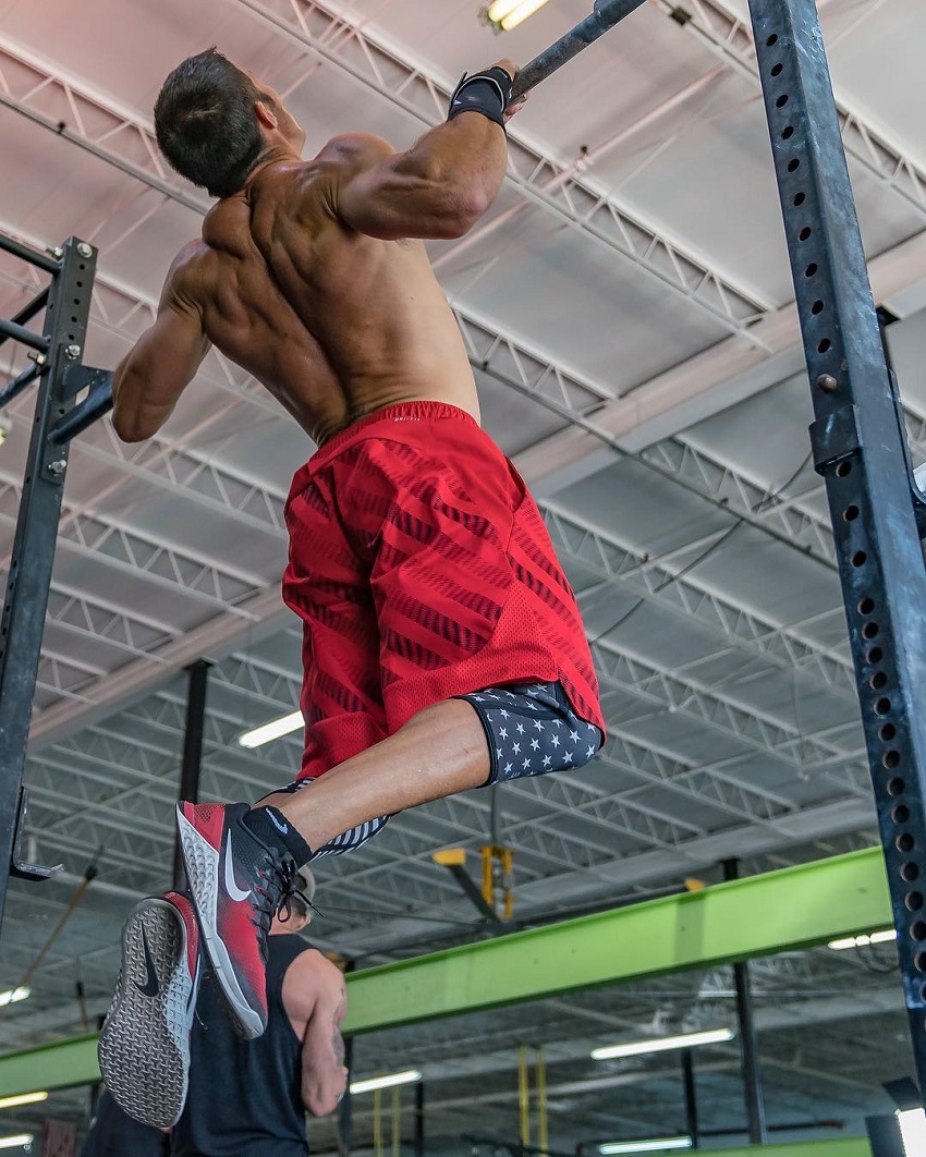 Shawn Ramirez doing pull ups while shirtless