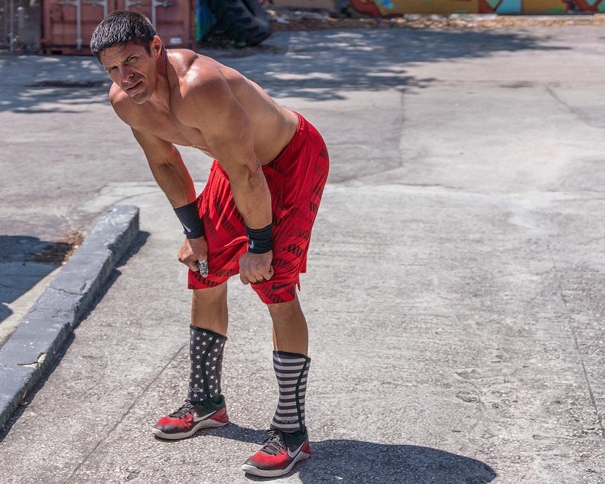 Shawn Ramirez resting his arms against his knees outdoors, looking healthy and strong