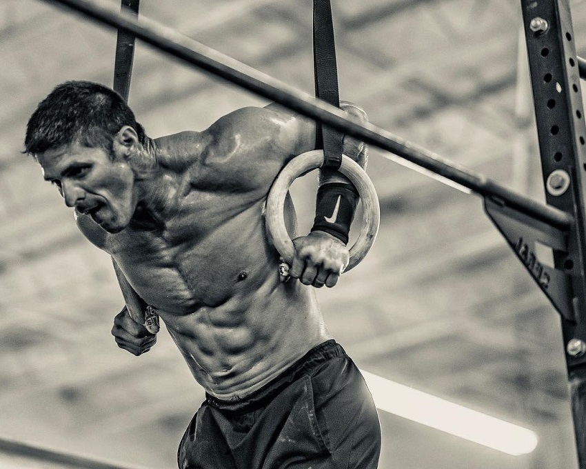 Shawn Ramirez exercising on rings looking fit and lean.