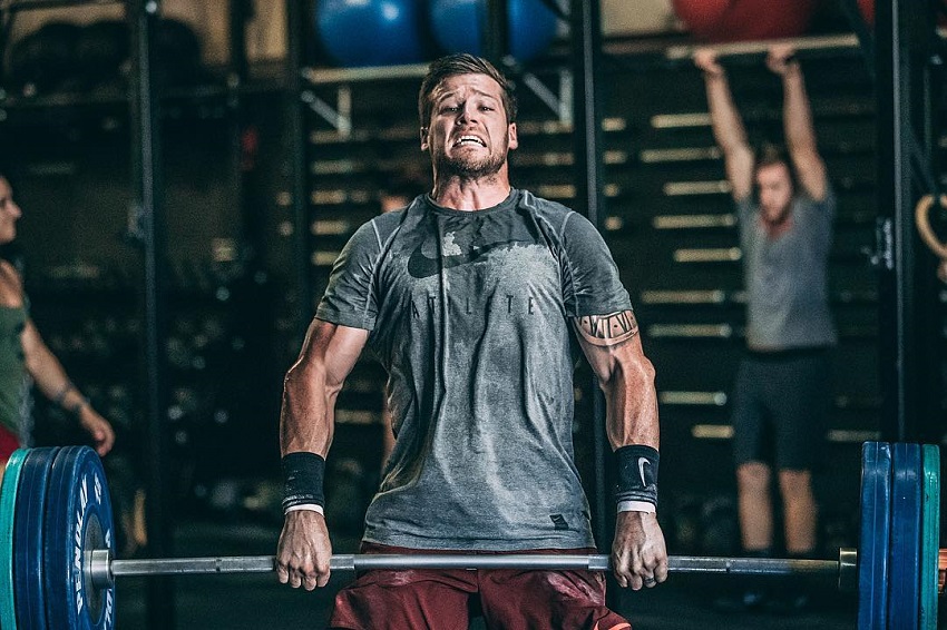 Travis Mayer doing heavy deadlifts in CrossFit