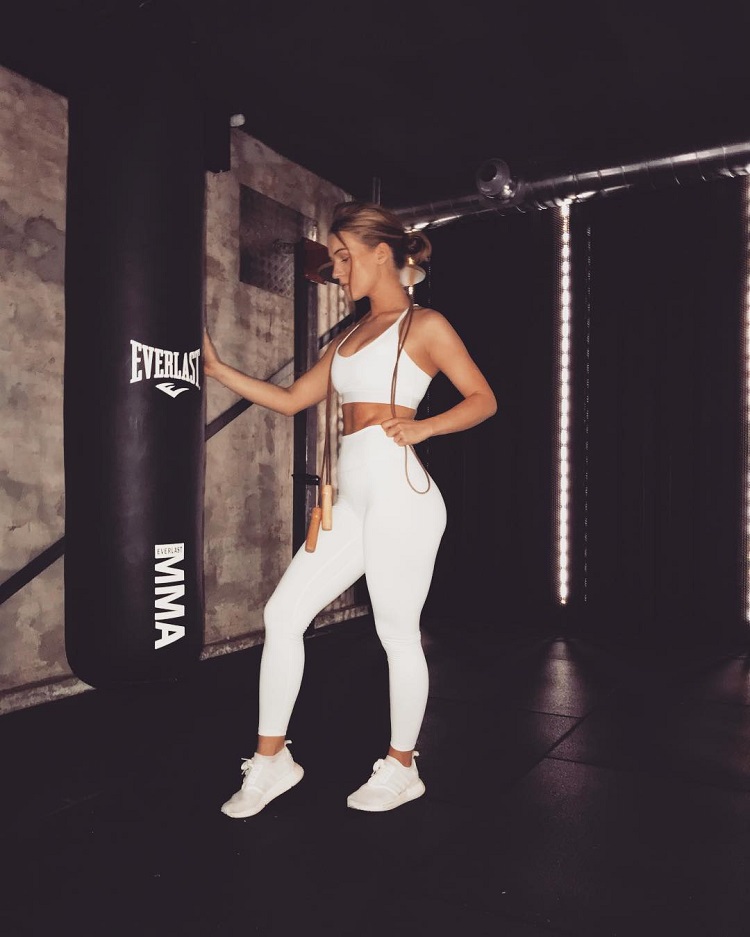 Celie Josefine Lindblad standing by a boxing bag looking fit and strong
