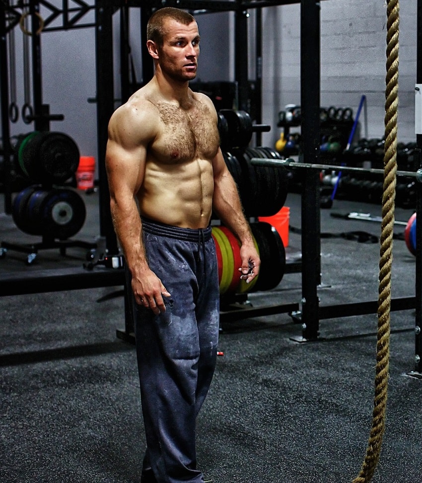 Mikko Salo posing shirtless for a photo looking ripped and strong