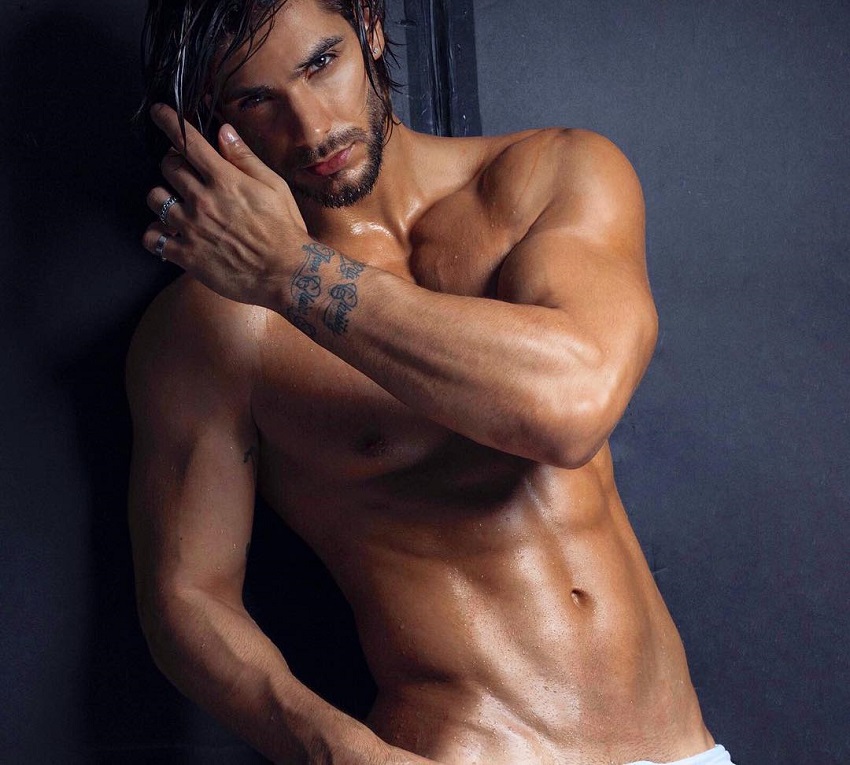 Paul Iskandar posing in a modeling photo shoot, looking chiseled