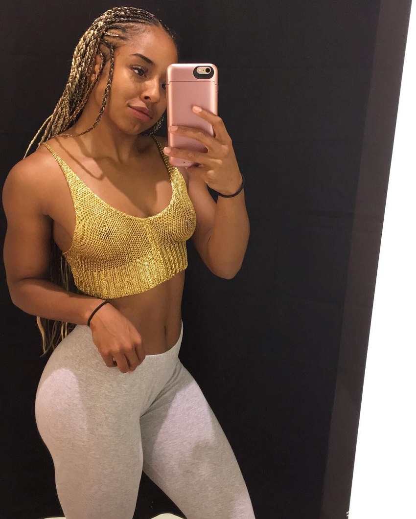 Qimmah Russo taking a selfie of her fit and lean physique