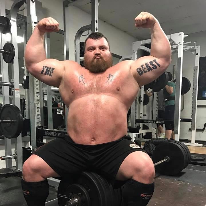 Eddie Hall performing a shirtless front double biceps pose for the photo