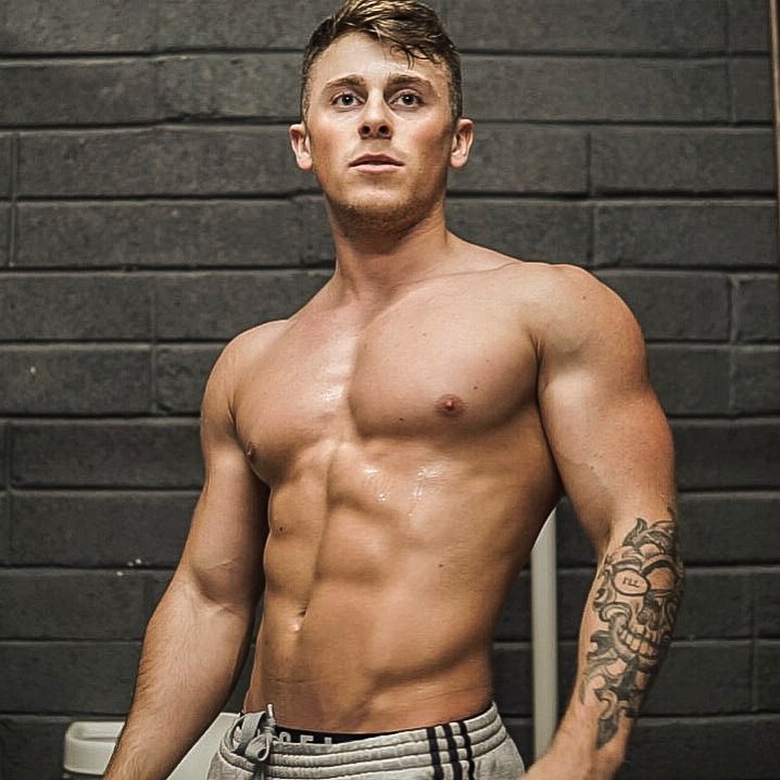Glen Gillen posing shirtless showing off his ripped physique