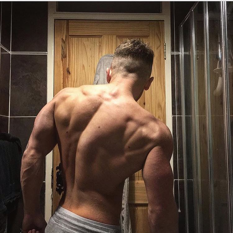 Glen Gillen showing off his shirtless back muscles