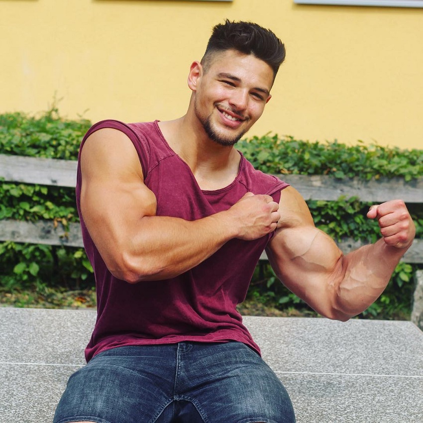 Jamar Pusch flexing his biceps for the photo