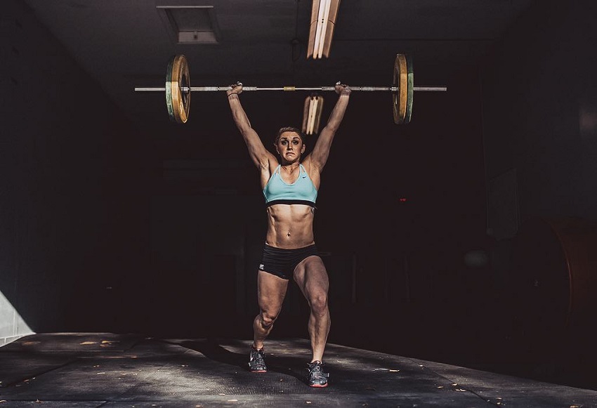 Mattie Rogers doing a heavy overhead press