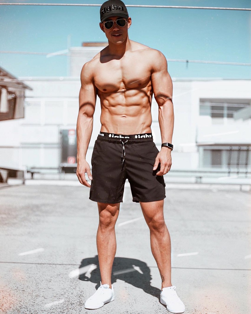 Nam Vo posing shirtless for the camera looking fit and strong