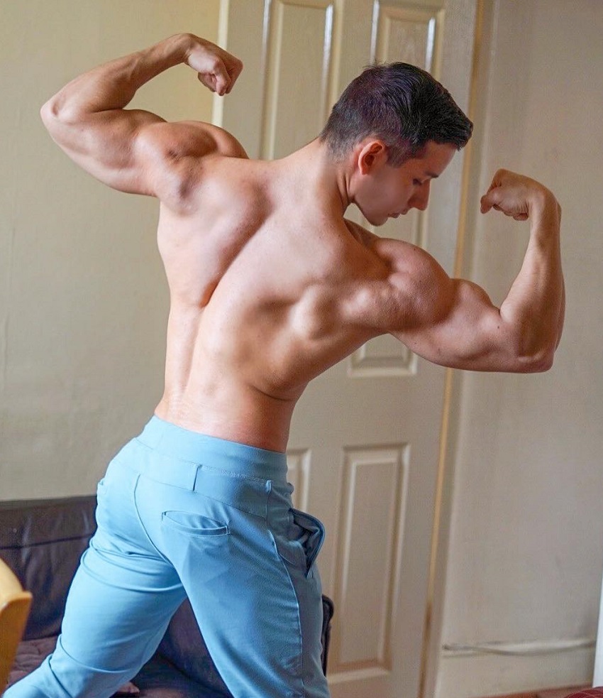 Radoslav Raychev doing a back double biceps pose for a photo