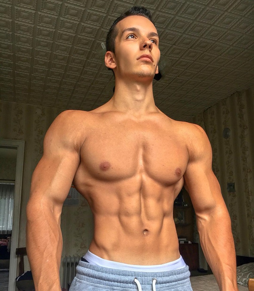 Radoslav Raychev posing shirtless for a photo looking ripped and muscular