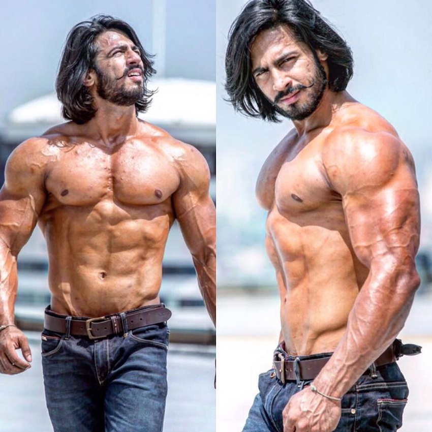 Thakur Anoop Singh walking shirtless outdoors looking big and ripped