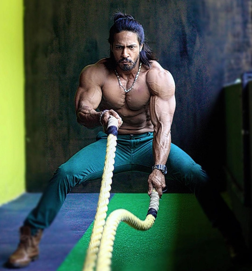 Thakur Anoop Singh doing battle ropes looking healthy and strong