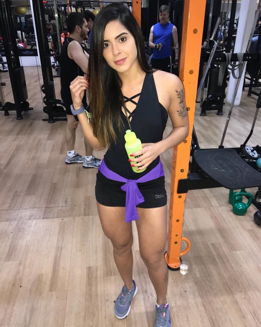 Luana Targino posing in a gym showing off her lean figure