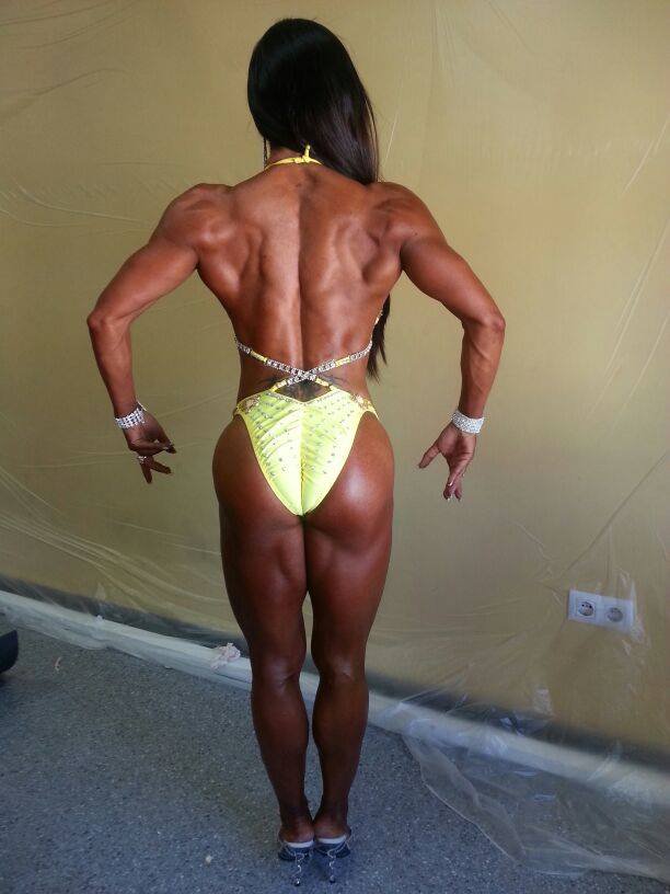 Sonia Amat Sánchez posing with her muscular back before a competition