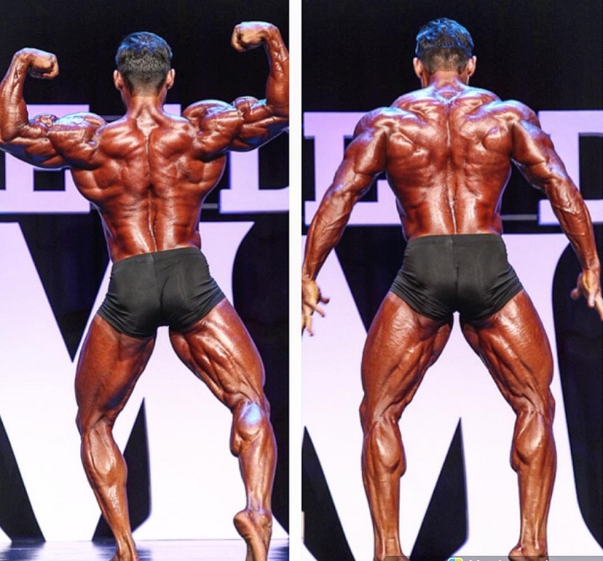 Abtin Shekarabi posing on the Mr. Olympia Bodybuilding Stage looking huge and ripped