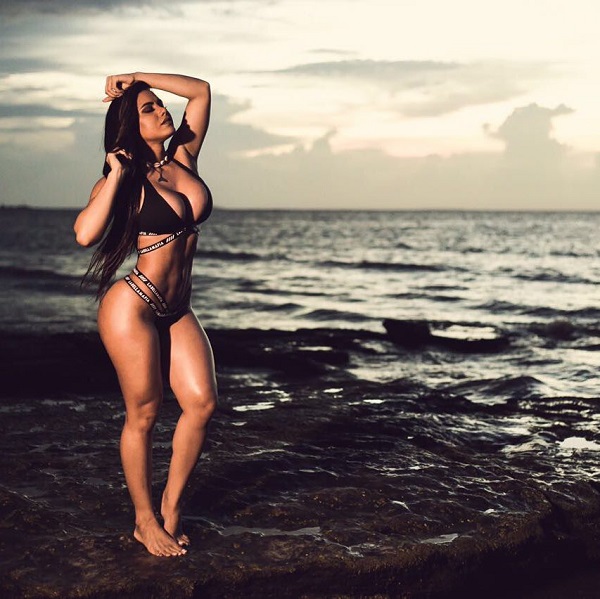 Bruna Barreto standing on a beach looking fit