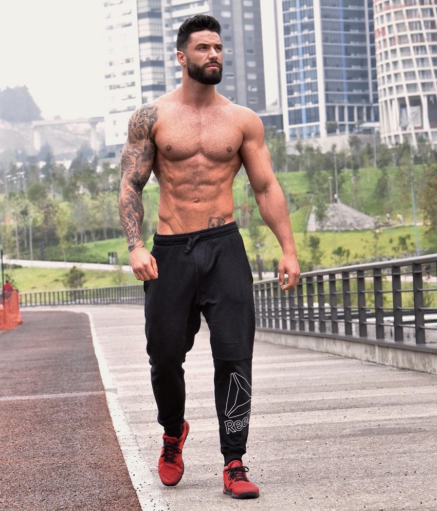 Fernando Lozada Zuniga walking down the bridge shirtless, looking fit and ripped