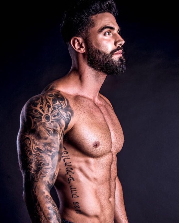 Fernando Lozada Zuniga posing shirtless in a photo shoot looking muscular and ripped