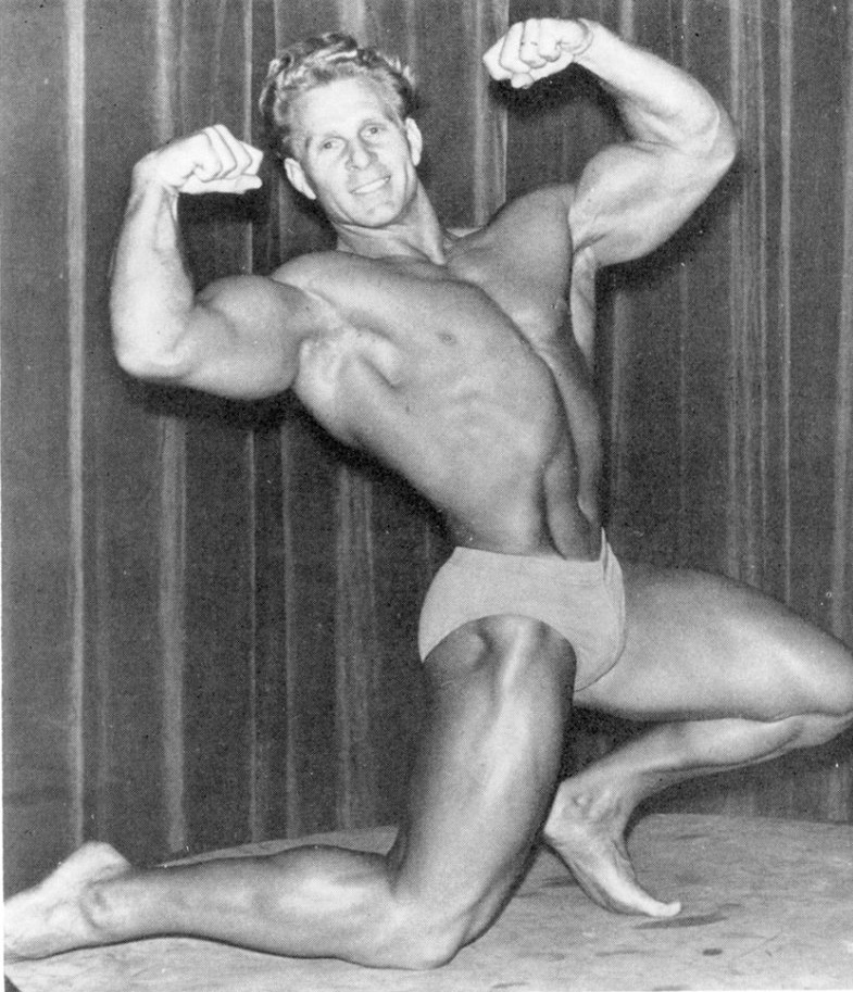 Jack Delinger flexing his muscles for the photo looking strong and ripped
