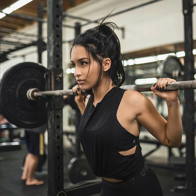 Jazmine Garcia performing heavy squats looking curvy and fit