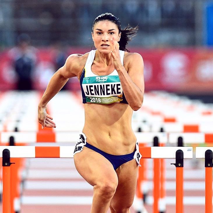 Michelle Jenneke sprinting during a competition, looking extremely focused