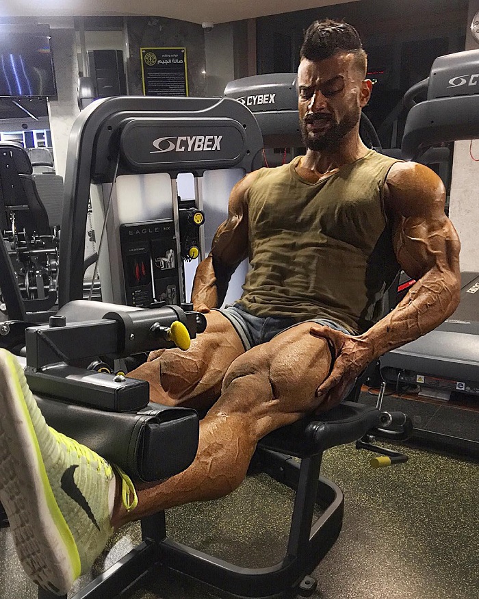 Mohamed El Qadi doing leg extensions