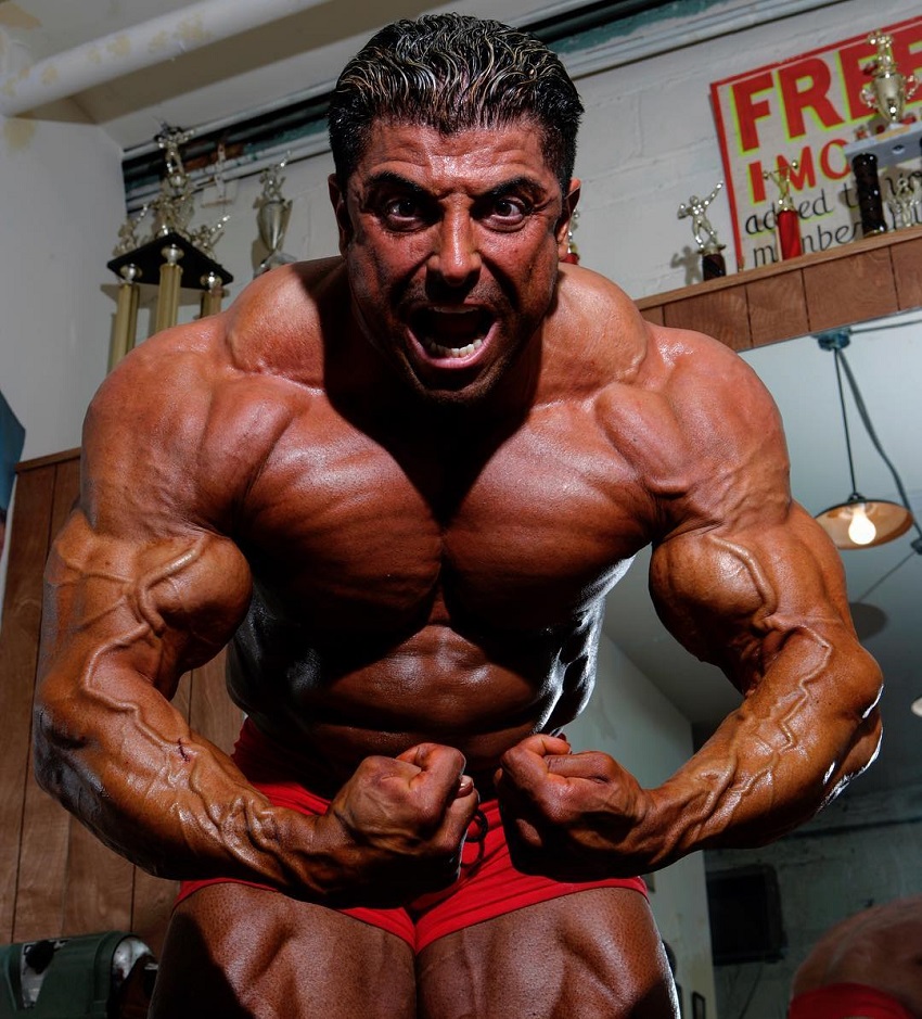 Shahriar Kamali doing the most muscular pose looking huge