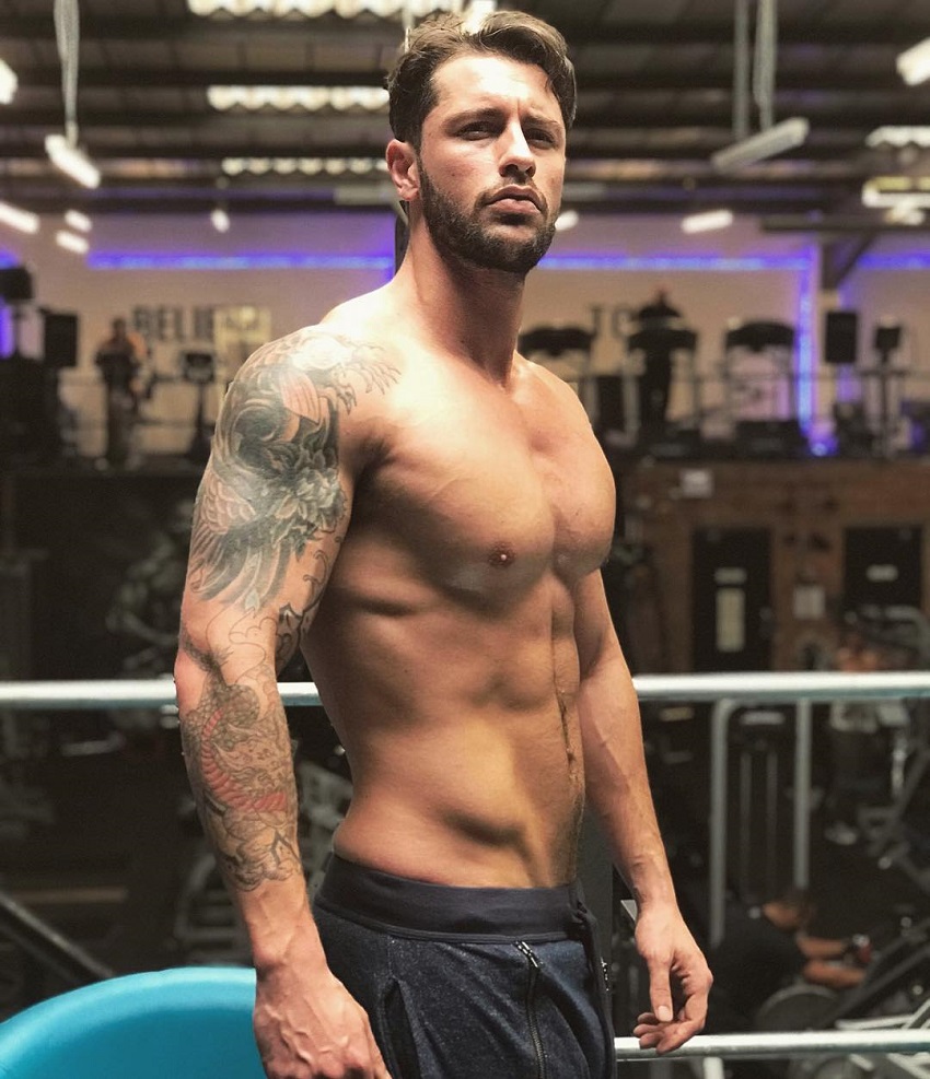 Vince Azzopardi posing shirtless for a photo looking lean and strong