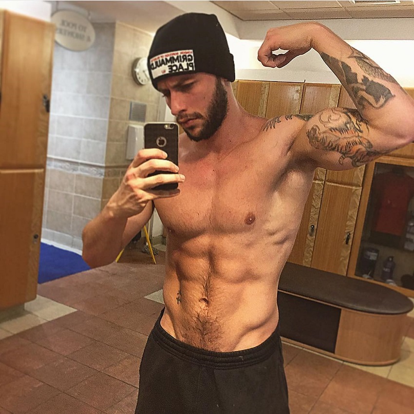 Vince Azzopardi flexing his bulging biceps in a selfie