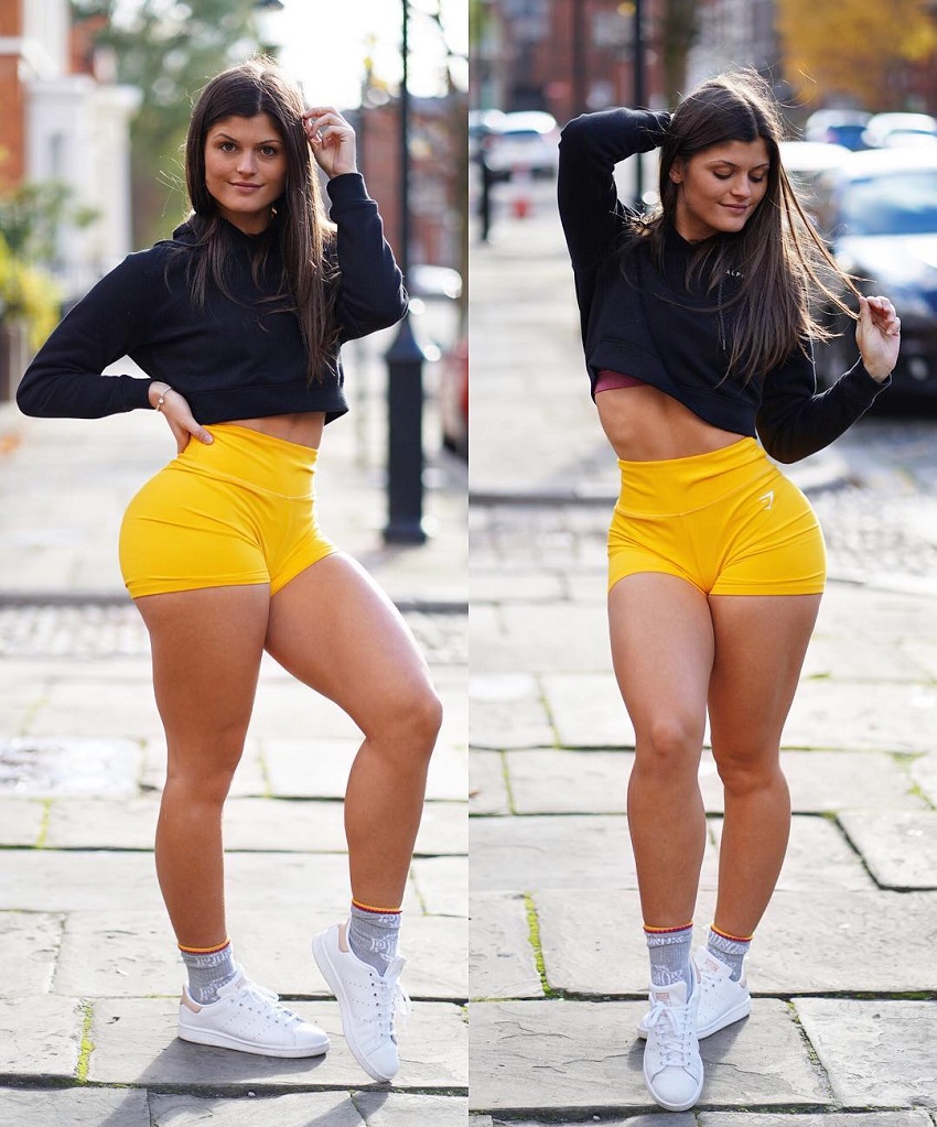 Elle Edwards posing on the street showing off her nicely toned legs