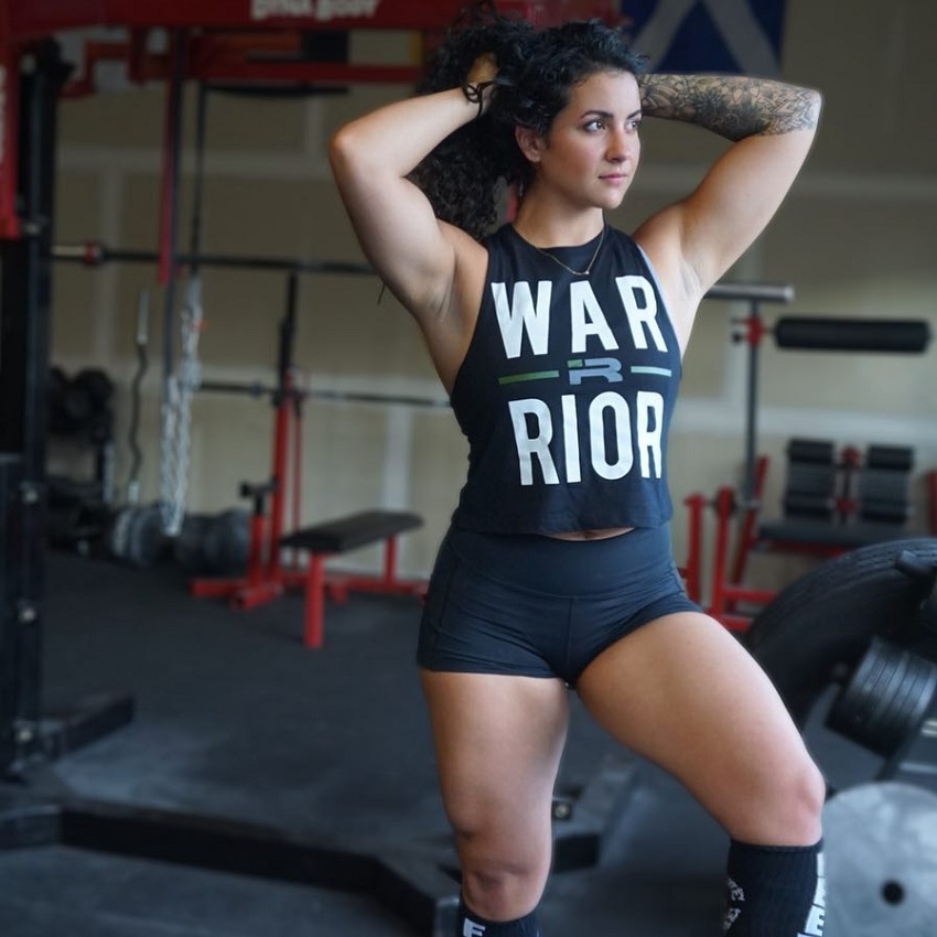 Gina Felice Aversa fixing her hear while looking in the distance