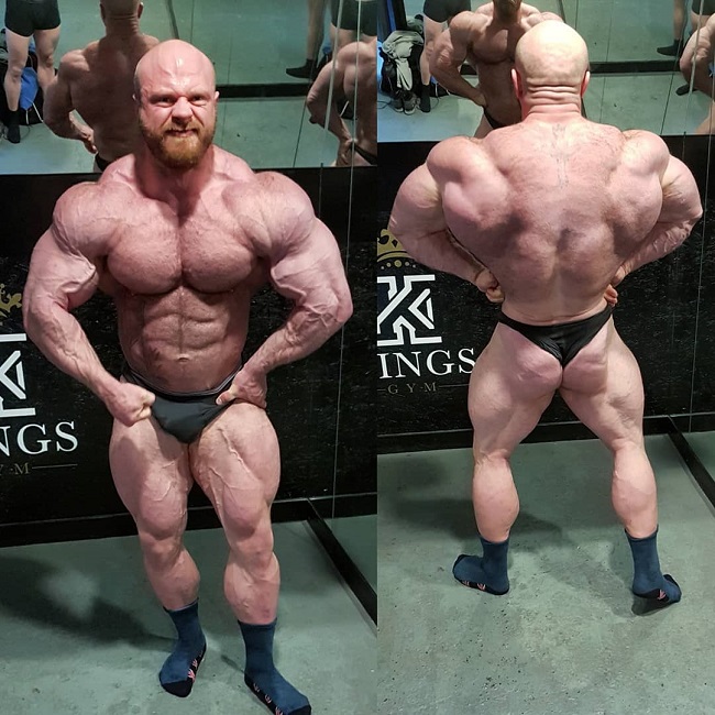 James Hollingshead posing shirtless for the photo, looking massive and conditioned