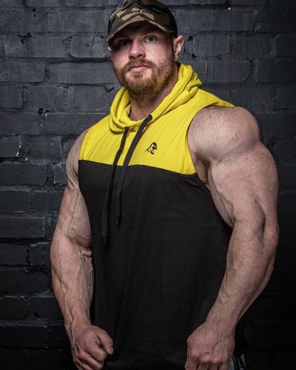 James Hollingshead posing for the photo in sportswear looking big and ripped