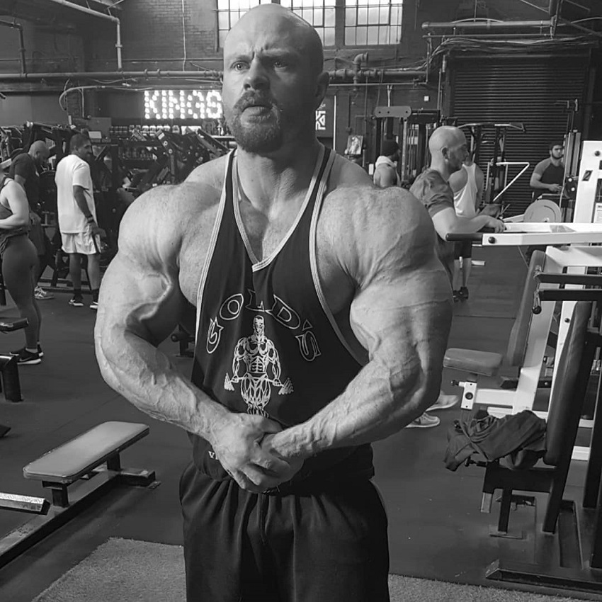 James Hollingshead posing for the camera looking huge and swole