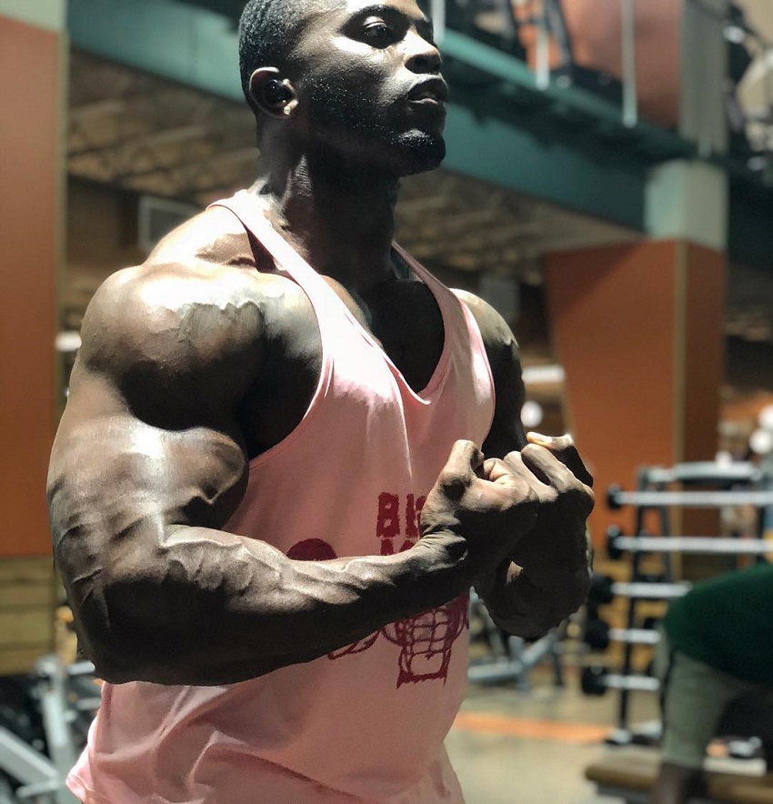 Kenneth Owens flexing for the photo looking big and ripped