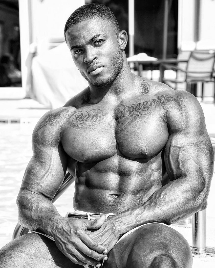 Kenneth Owens posing shirtless for a photo looking ripped and big