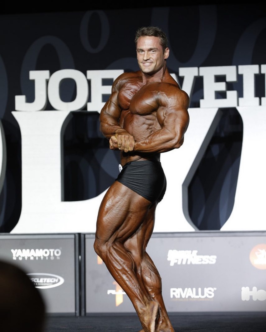 Stanimal De Longeaux posing on the Olympia stage