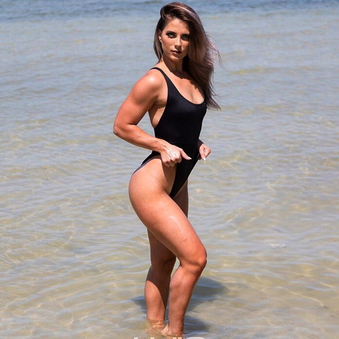 Taylor Brown standing on the shore looking fit and lean
