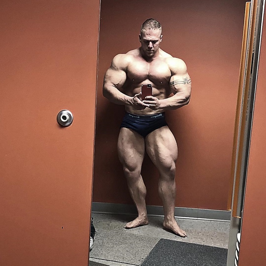 Brandon Beckrich taking a selfie of his ripped and huge body in the mirror