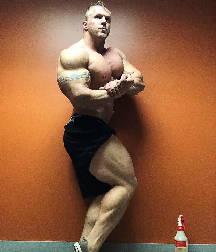 Brandon Beckrich performing a shirtless side chest bodybuilder's pose