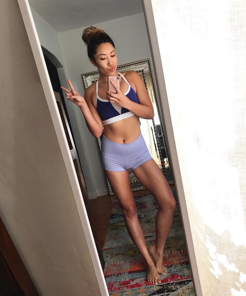 Cassey Ho taking a selfie of her lean and toned body