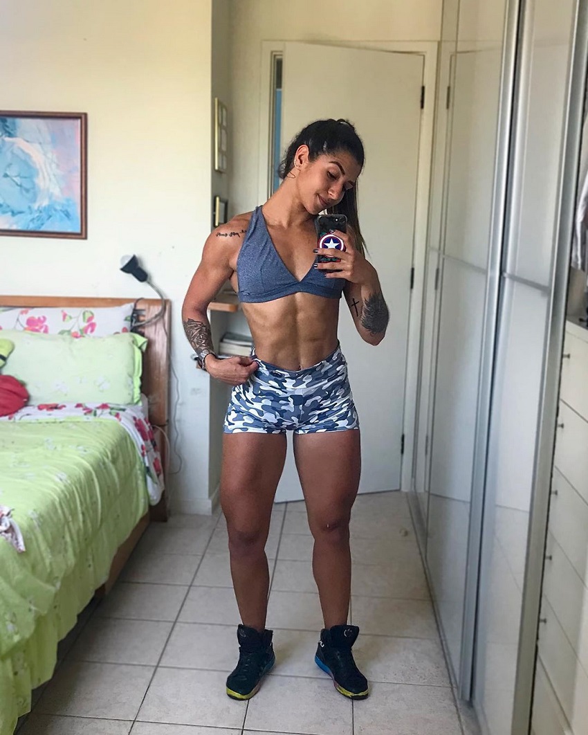 Dominique Aquino taking a selfie of her ripped body